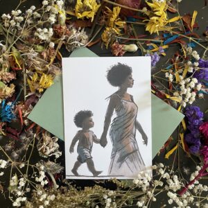 Hand-drawn Mother's Day greeting card featuring a Black mother and child walking together, displayed on a flat lay with dried flowers